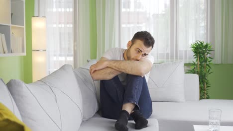 Depressed-young-man-thinking-sad-and-sad-at-home